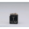 Météorite Lunaire Laâyoune 002 dans une boite Feld Breccia (Maroc - 0.202 gramme - 053**)