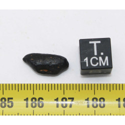 Tectite Atacamaite dans une boite (Chili - 0.68 gramme - 010 **)